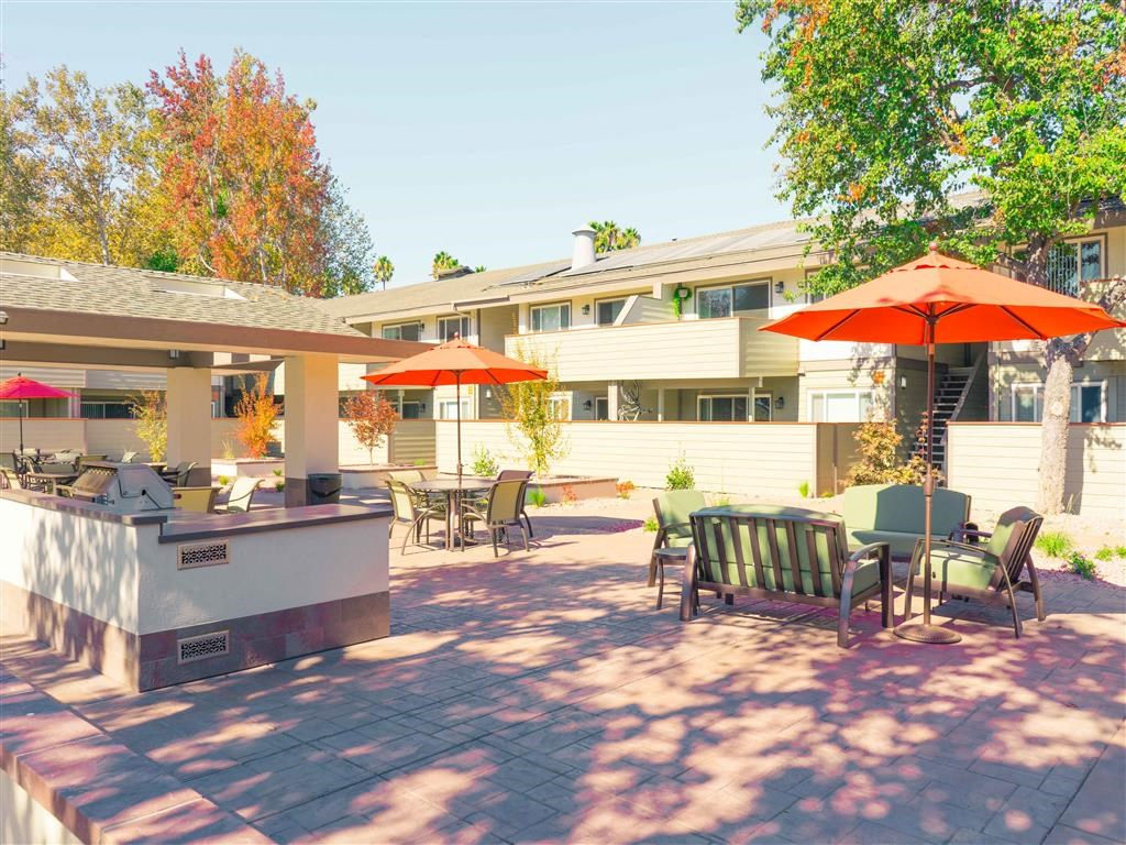 Umbrella Shaded Chairs By Pool at Balboa Apartments, Sunnyvale, California