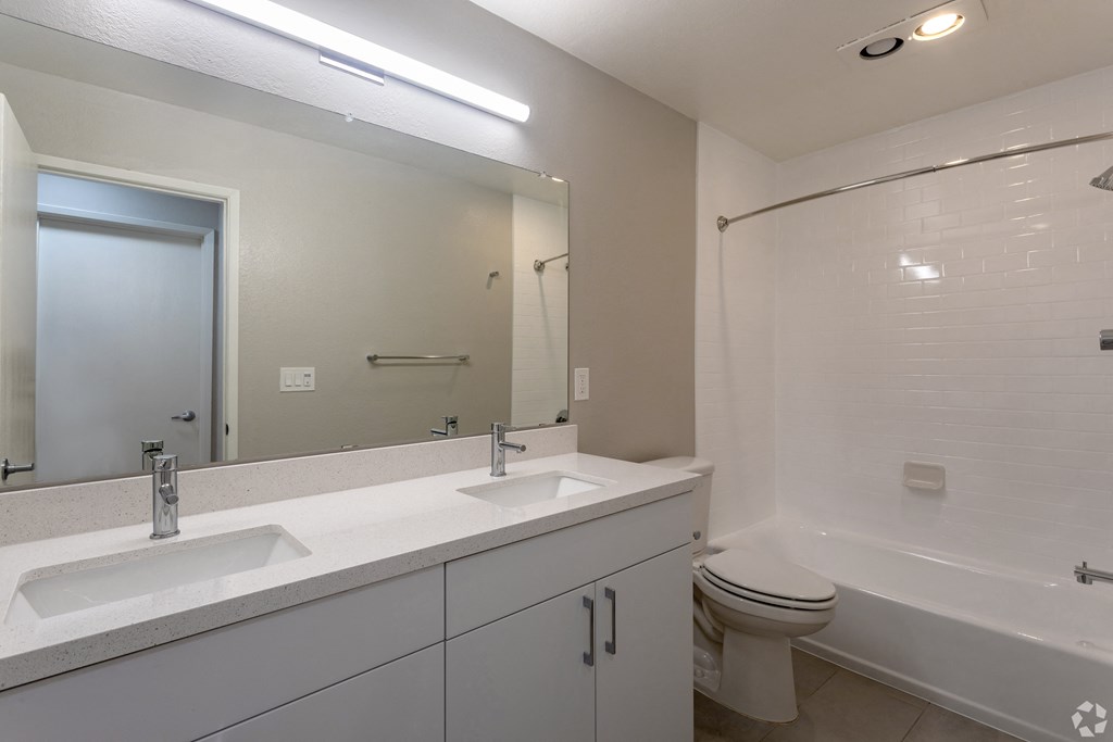 the preserve at ballantyne commons apartment bathroom with sink toilet and shower