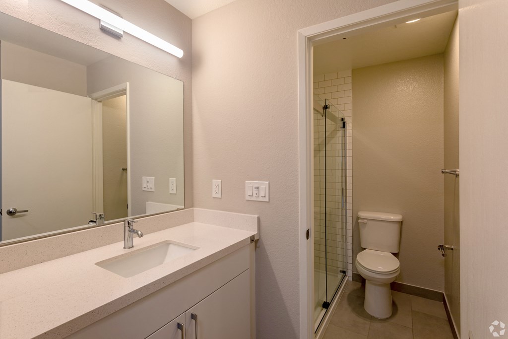 the preserve at ballantyne commons bathroom with sink toilet and shower