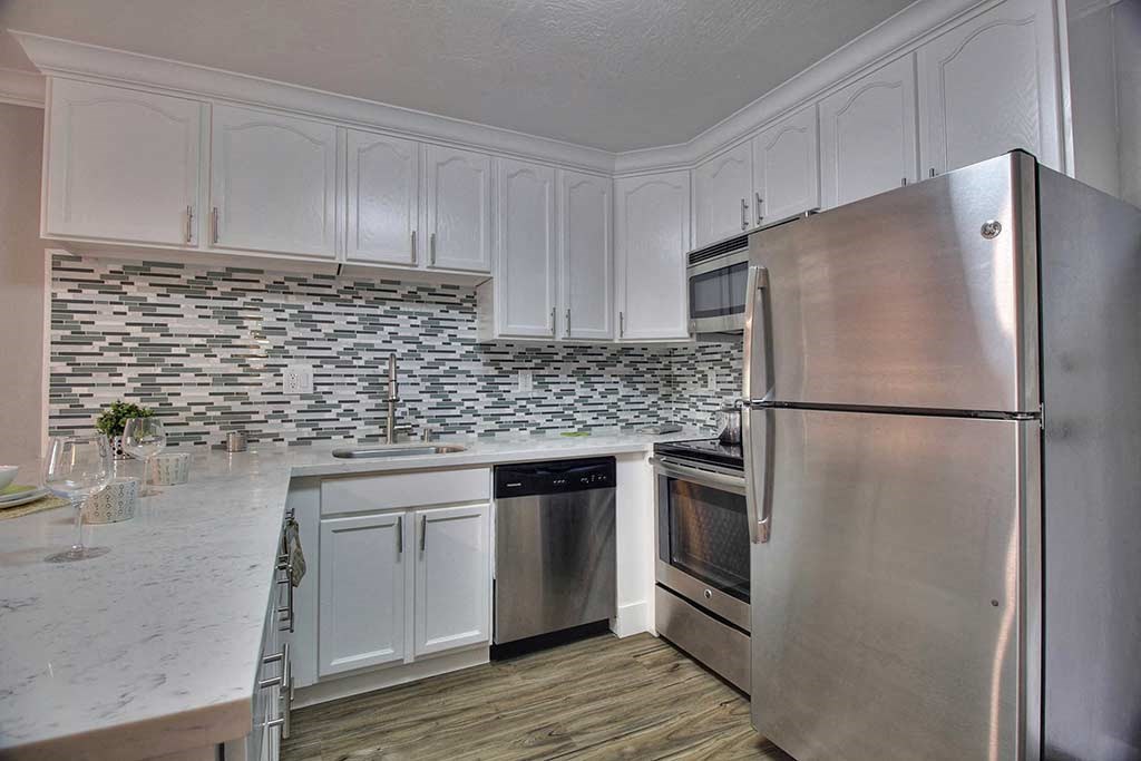 Kitchen gallery with cabinets at The Luxe, California