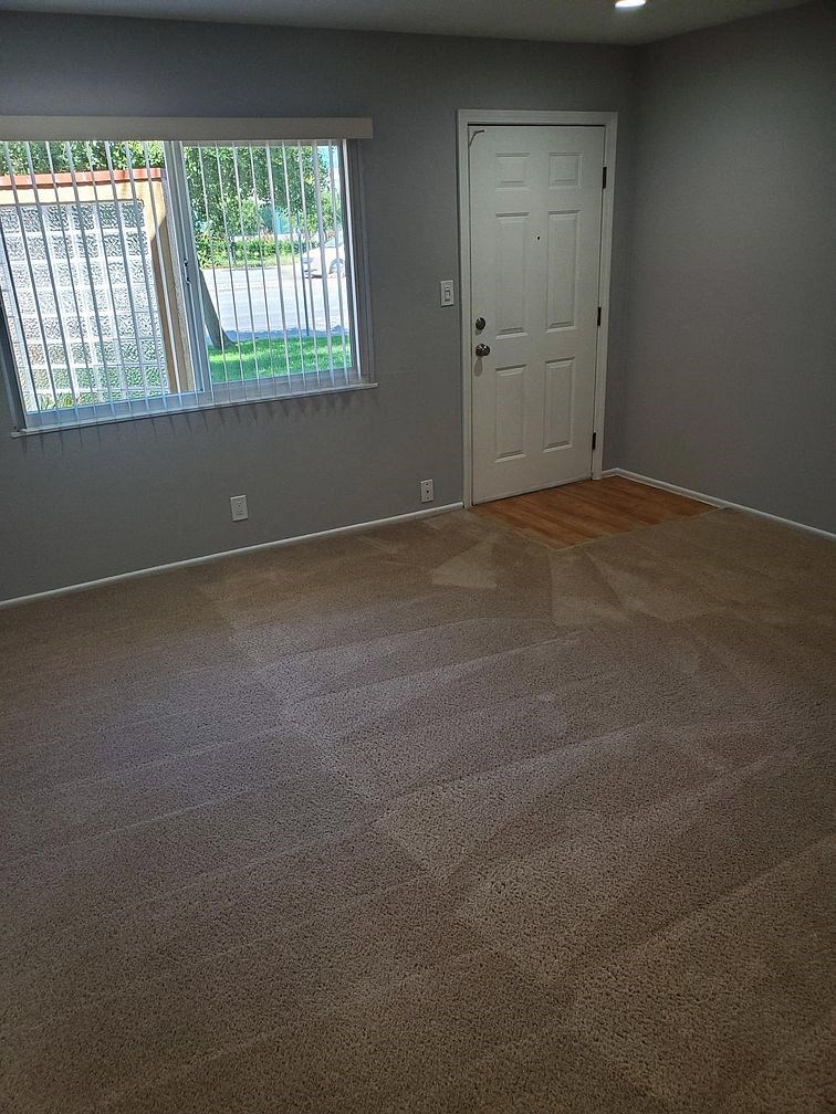 A room with a door and a window.