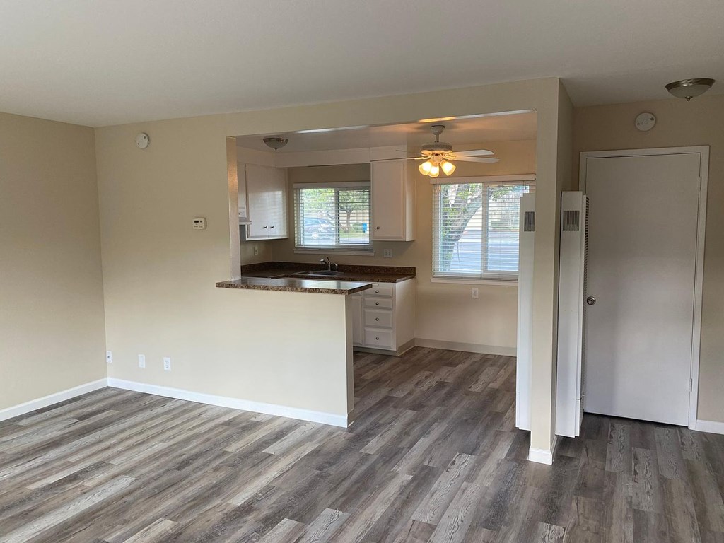 A kitchen area with a countertop and cabinets.