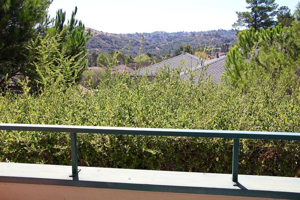 A view from a balcony overlooking a residential area.