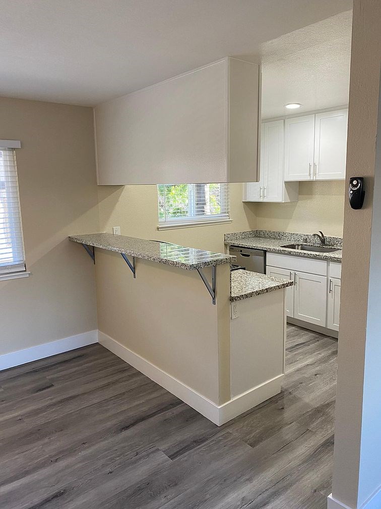 A kitchen with a countertop and cabinets.