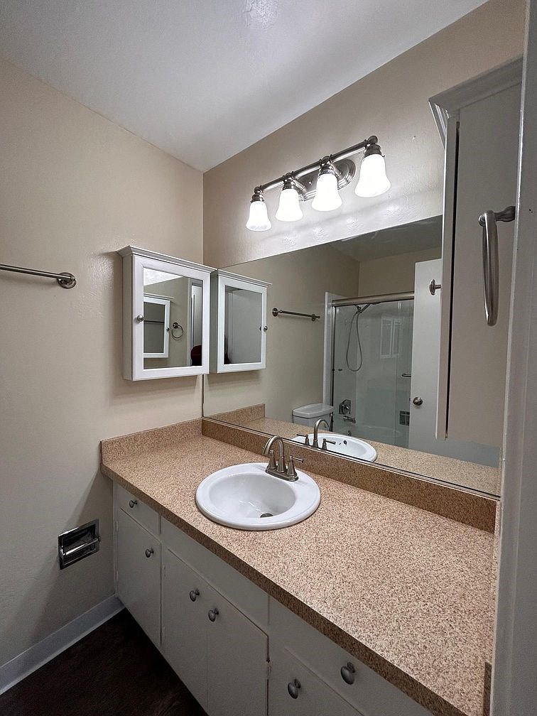 a bathroom with a sink and a mirror