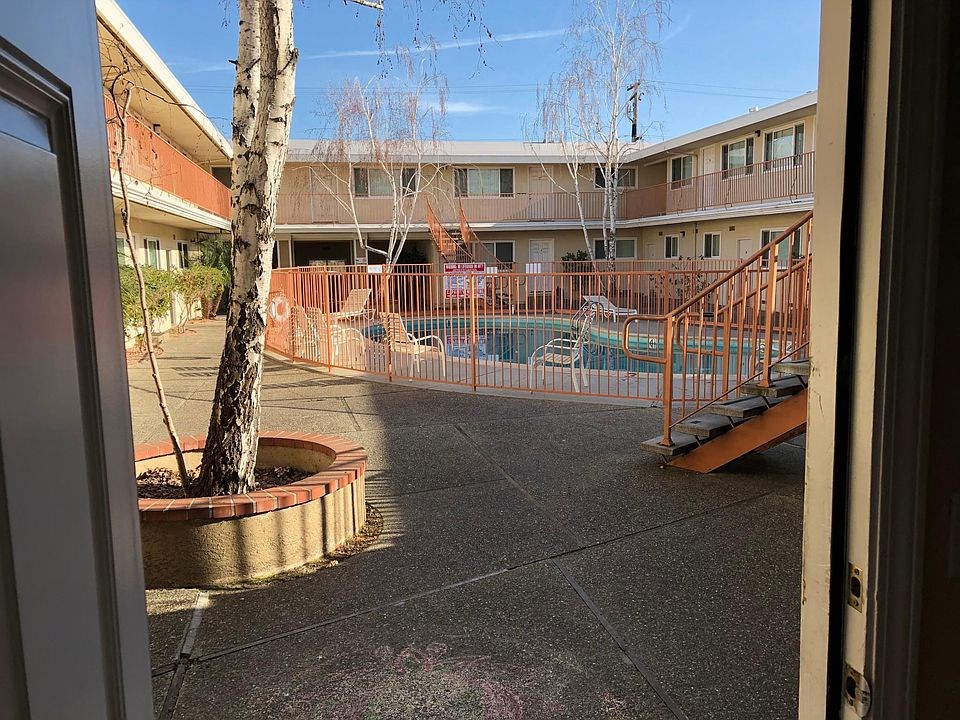 a view of a swimming pool from a door
