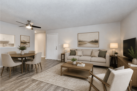 A living room with a dining table and chairs.