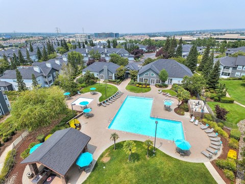 Aerial view of resortstyle pool with sun deck at Rosemeade Apartments, Roseville, 95661