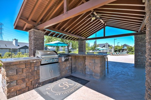 Outdoor grilling station with covered pavilion and countertop at Rosemeade Apartments, Roseville, 95661