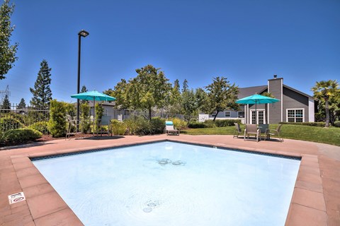 Community pool with spa jets and sundeck at Rosemeade Apartments, Roseville