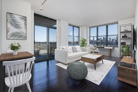 A modern living room with a white sofa and a wooden coffee table.
