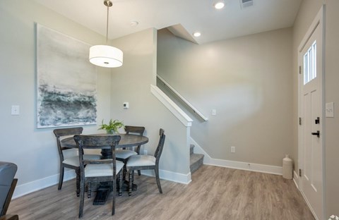 A dining room with a table and chairs at Ventura Townhouses, Michigan, 49460