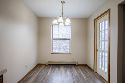 A room with a window and a door.