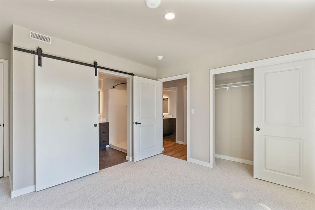 Bedroom with sliding door to bathroom, closet, 2nd bathroom