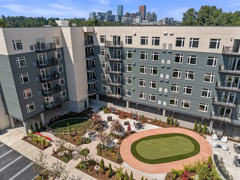 A large building with a green lawn in front of it
