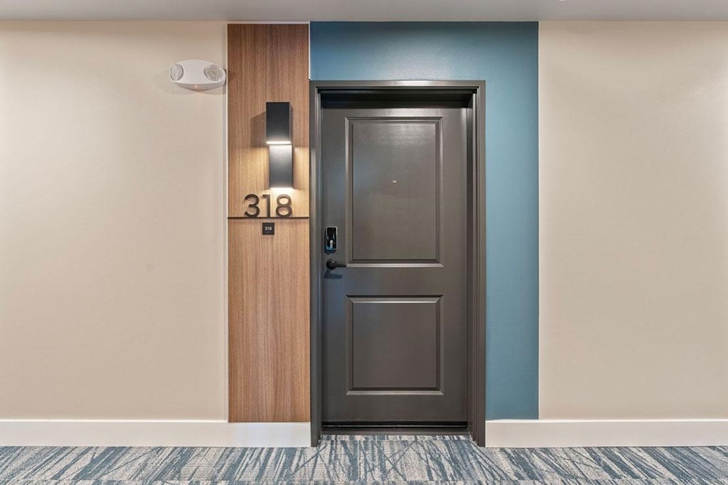 A door with the number 318 n it is closed