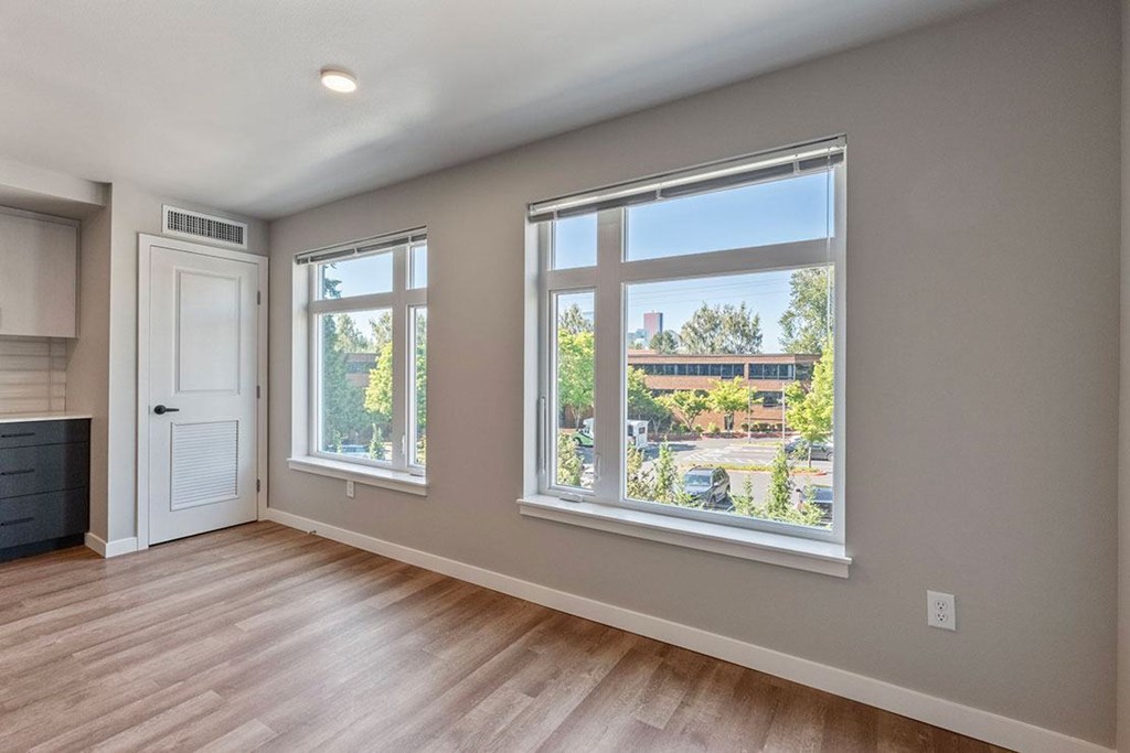 A room with a large window and a door