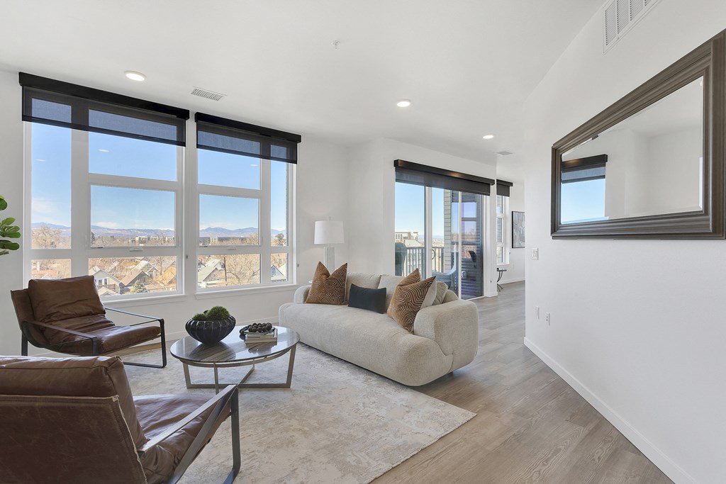 a living room with a couch and two chairs