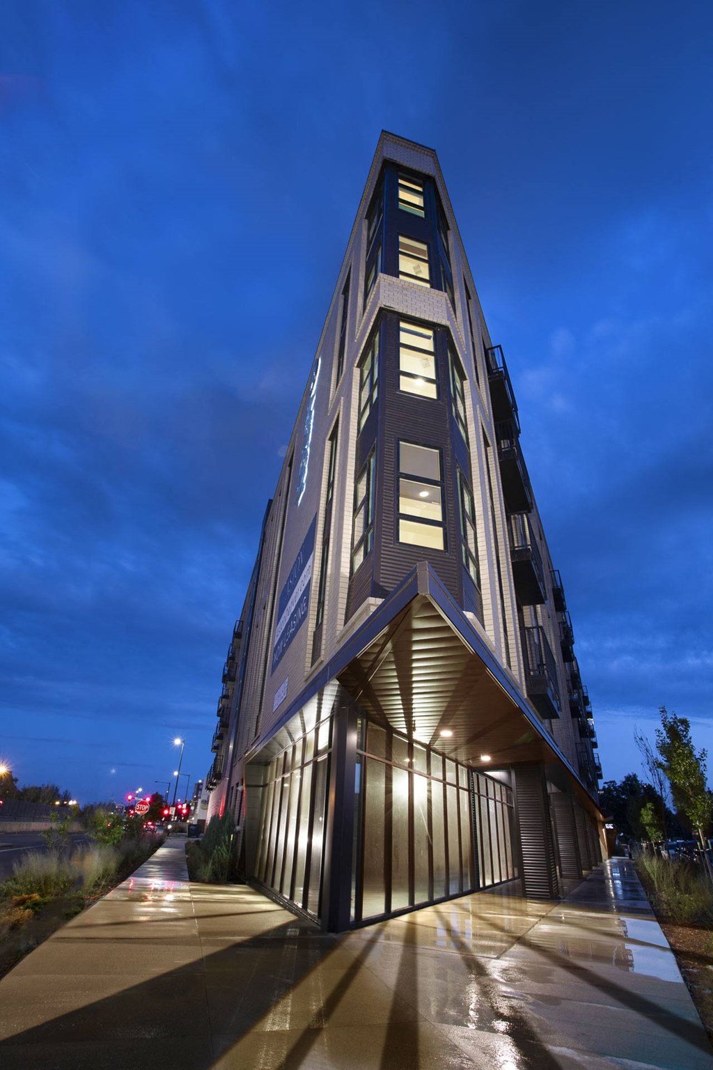a tall building at night with its lights on
