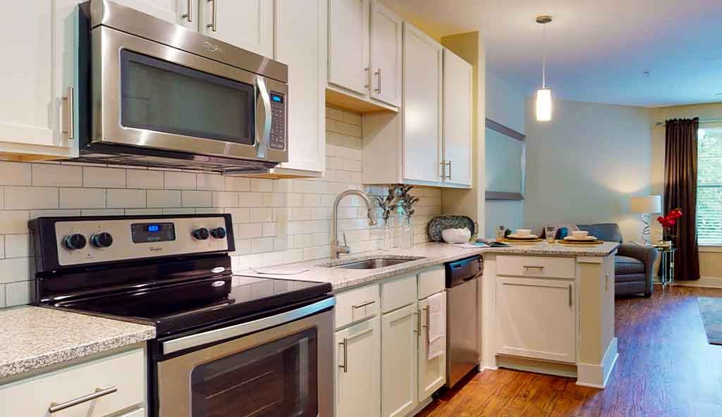 a kitchen with a stove and a microwave