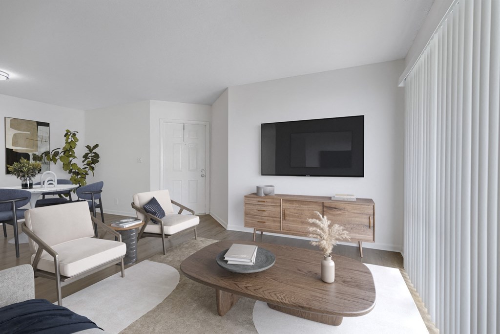 a living room with a tv on the wall