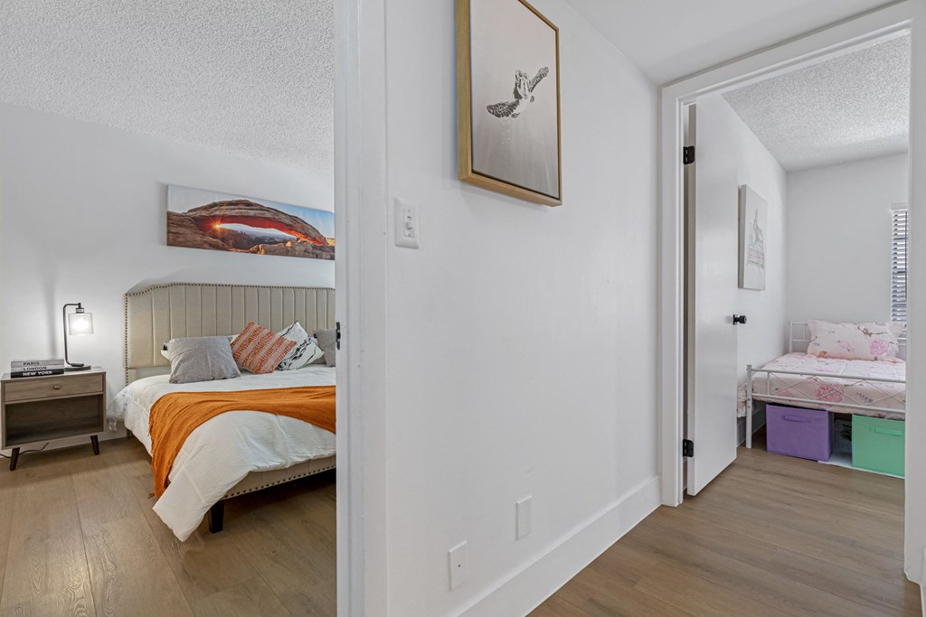 a bedroom with a bed and a mirror