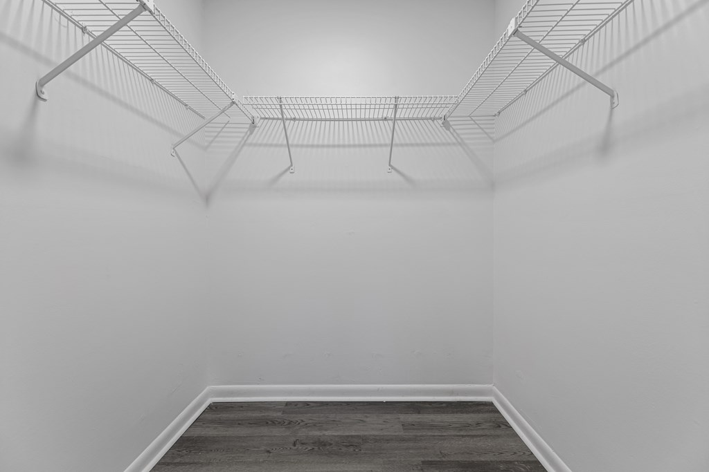 a room with white walls and a wooden floor