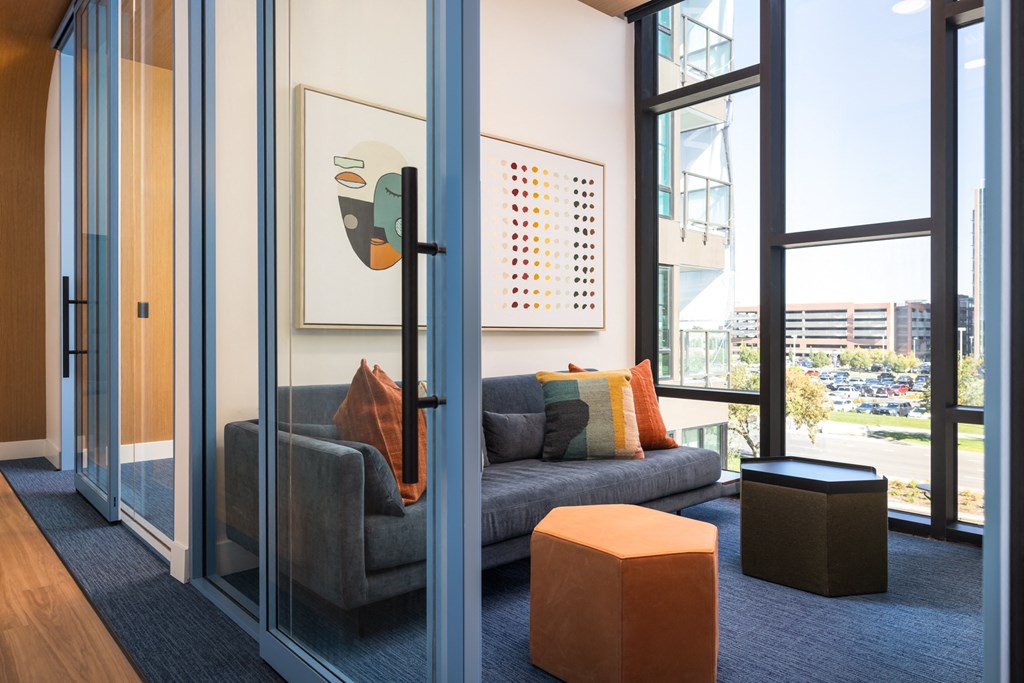 a living room with a couch and a window
