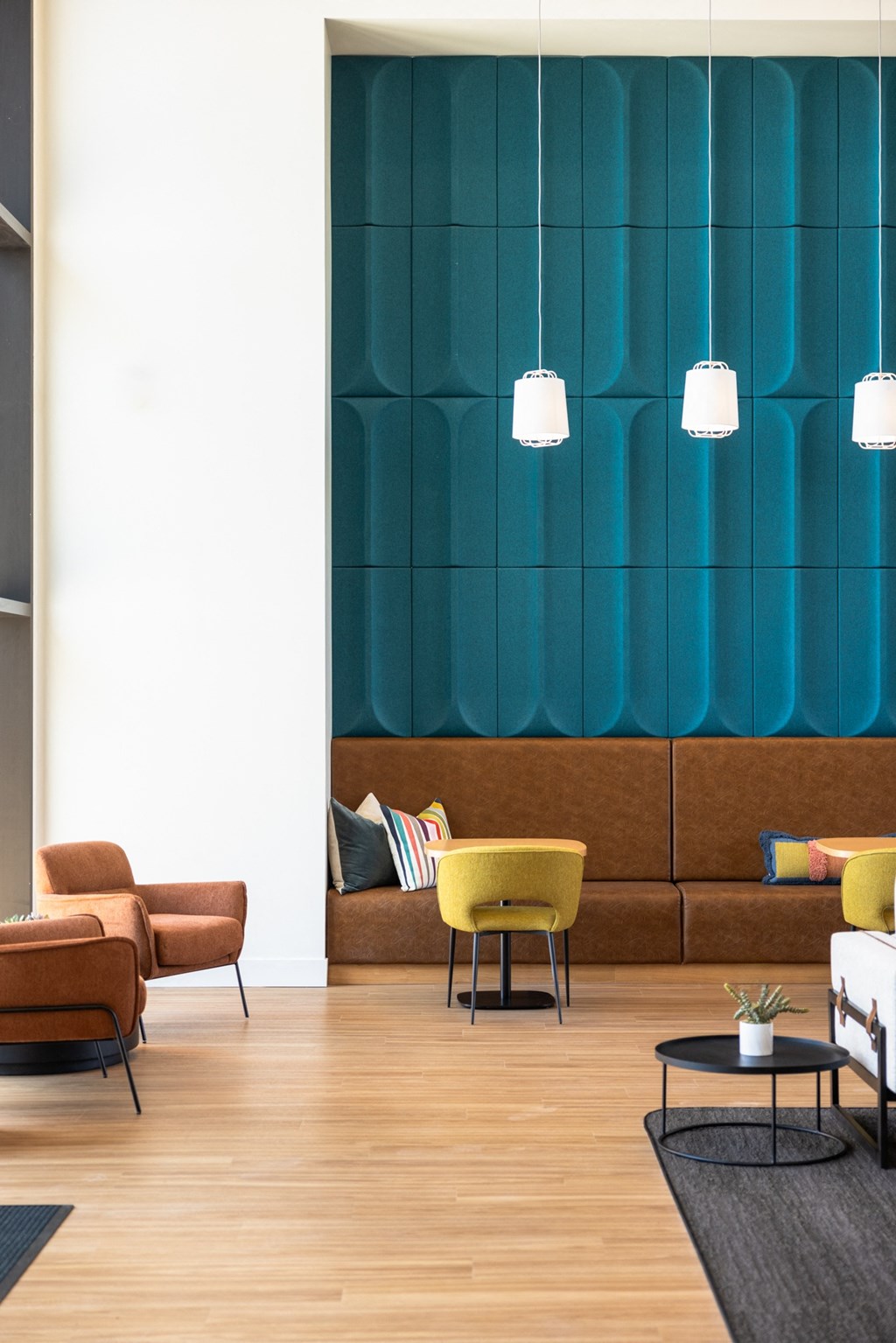 a living room with furniture and a blue wall