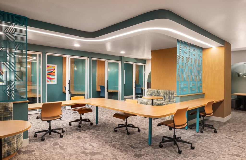 a conference room with a long table and chairs