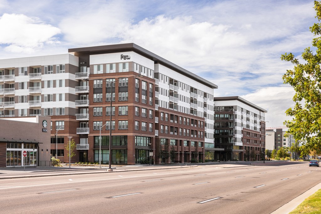 A large multi-story building with a sign that reads "Fraser" on the top floor.