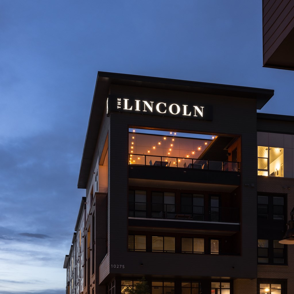 The Lincoln building is lit up at dusk.