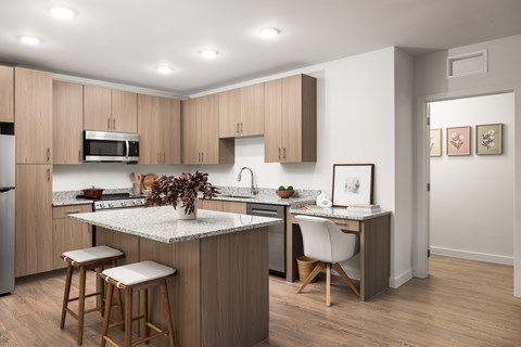 A kitchen with wooden cabinets and a white countertop.
