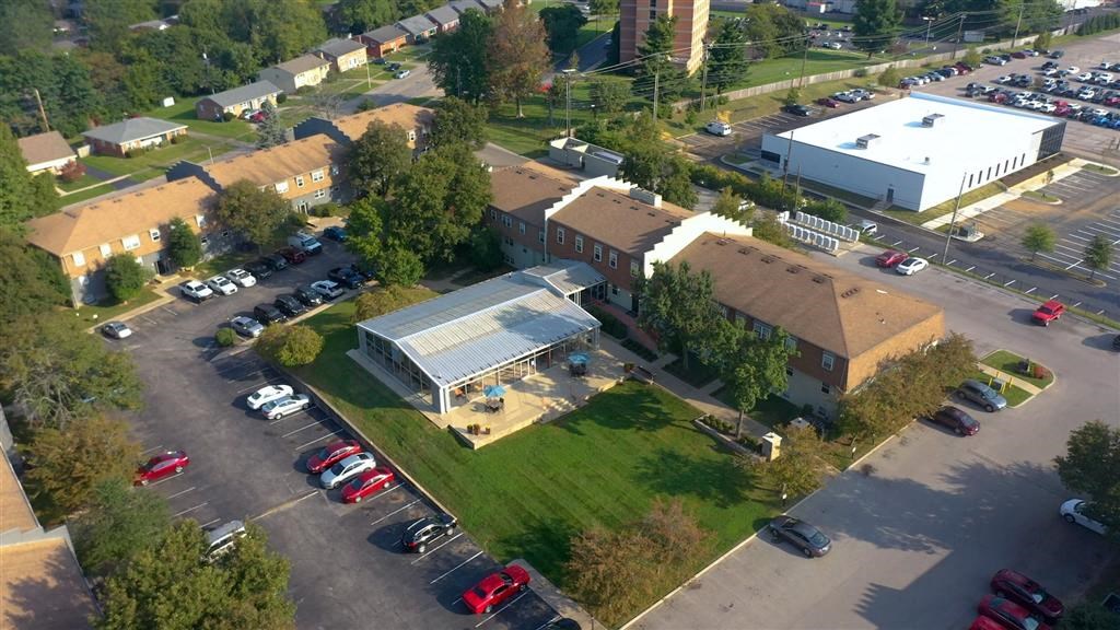 an aerial view of a building in a parking lot