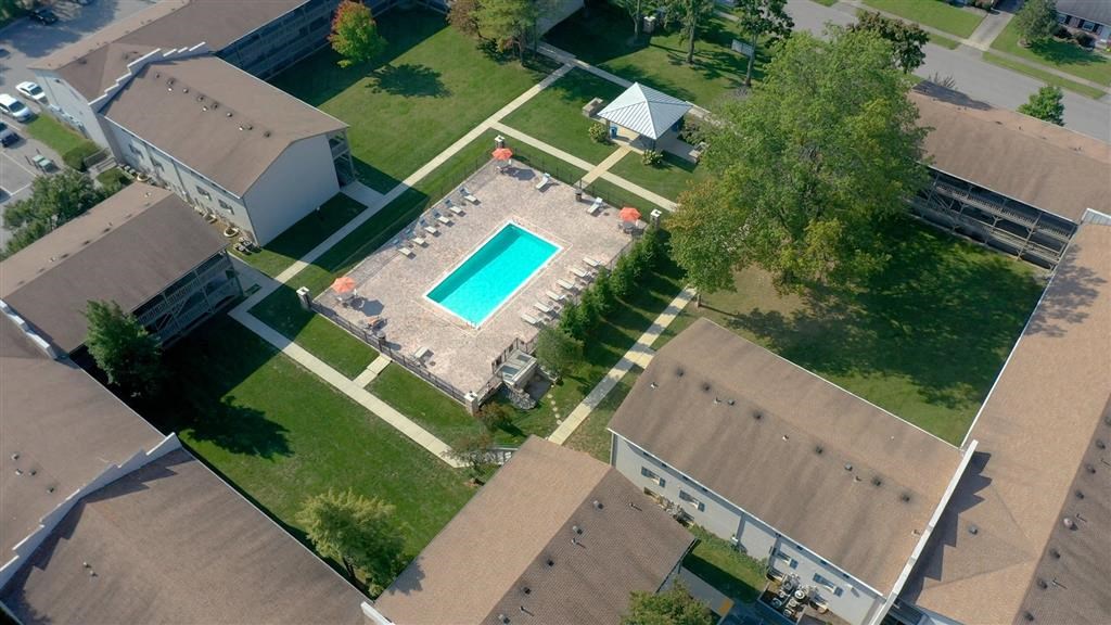 an aerial view of a house with a swimming pool