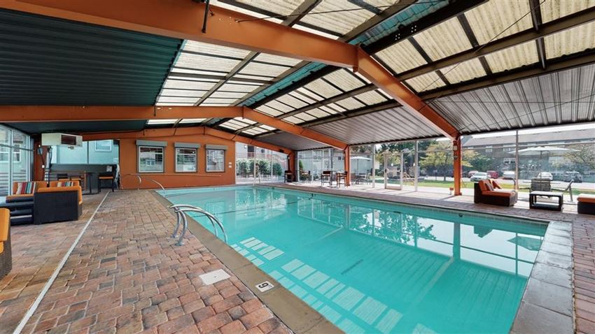 a swimming pool with a ceiling and brick floor - Photo Gallery