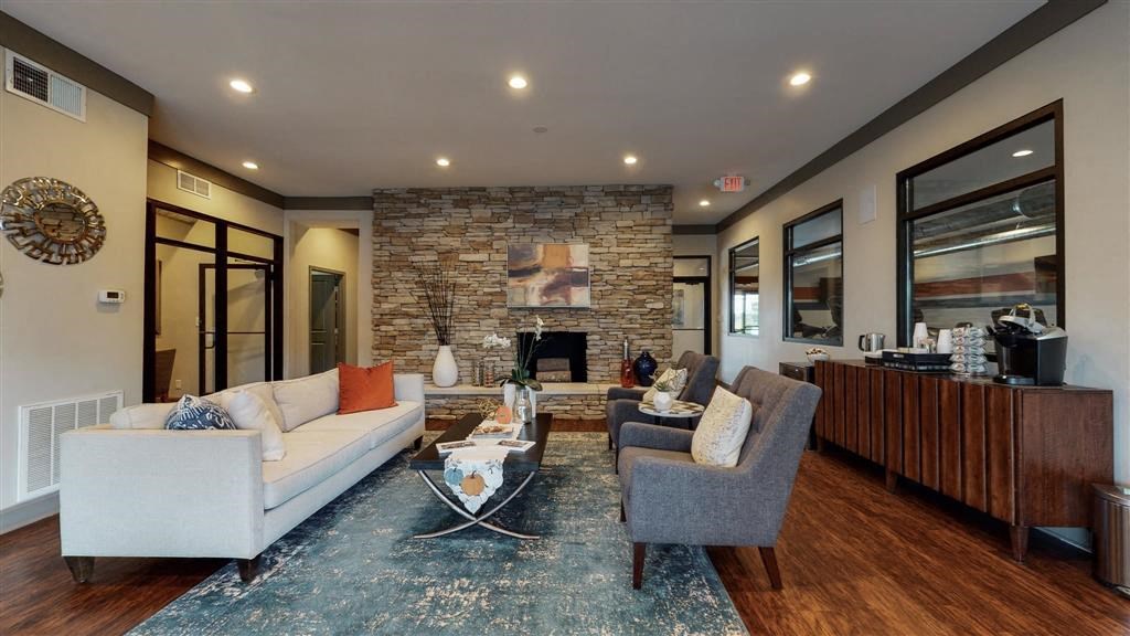 a living room filled with furniture and a fire place