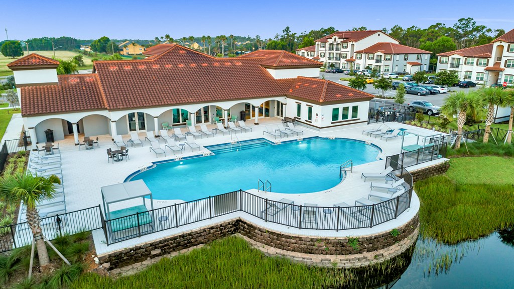 A large house with a pool in the backyard.