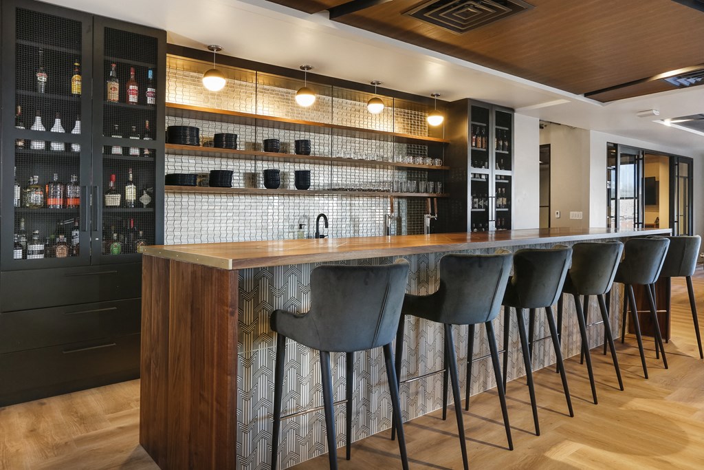 a bar in a restaurant with bar stools in front of it