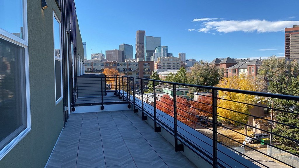 a balcony with a view of the boston skyline