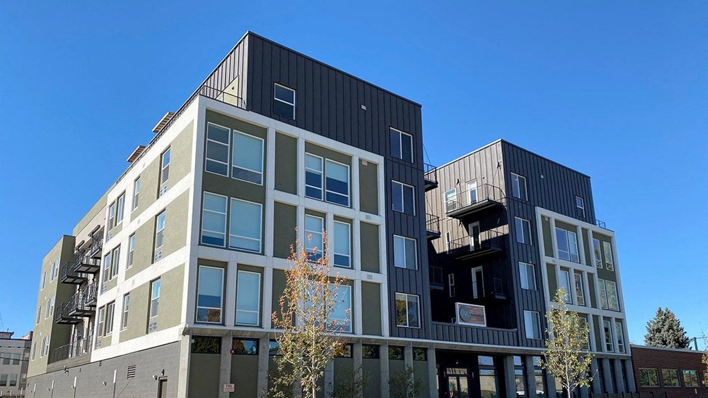 a building with two floors and two balconies