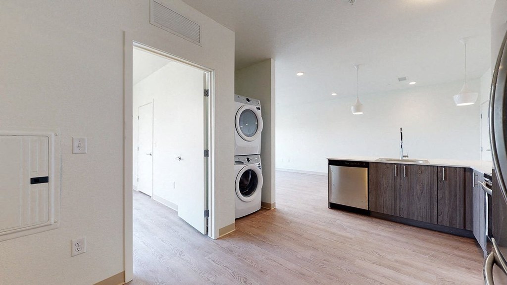 a kitchen with a washer and dryer