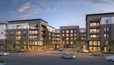 a rendering of an apartment complex on a city street