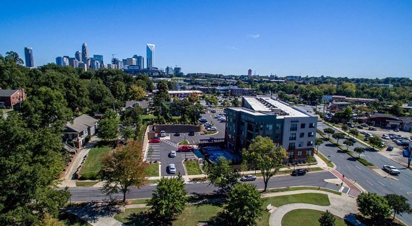 a parking lot with a city skyline in the background