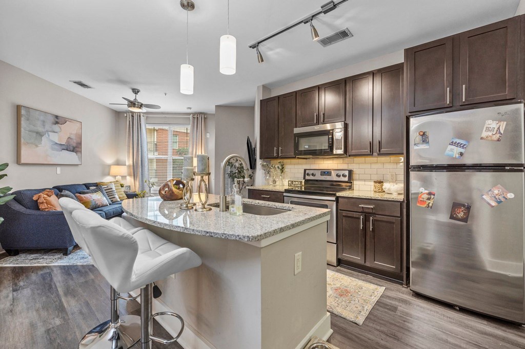 a kitchen with stainless steel appliances and a counter top