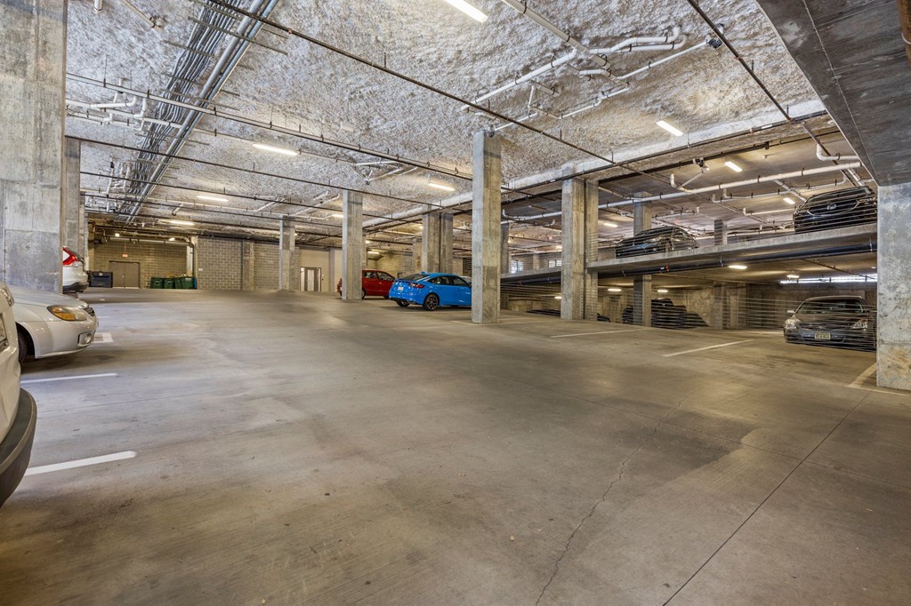 a parking garage with cars parked in it