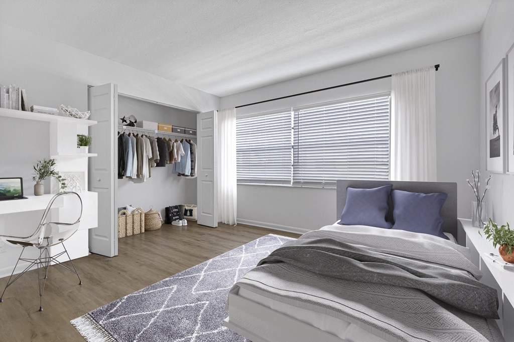 a bedroom with a bed and a wardrobe