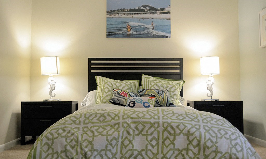 a bedroom with a bed and two night stands