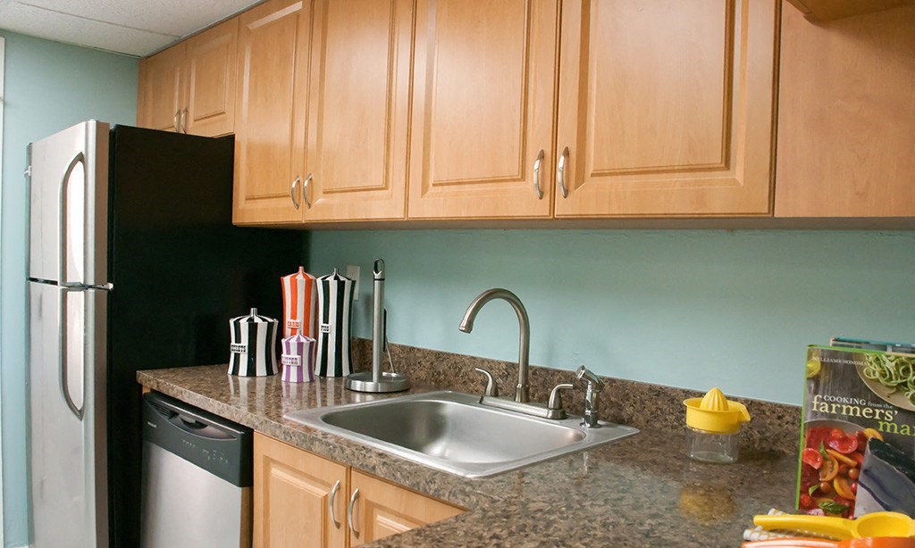 a kitchen with a sink and a refrigerator