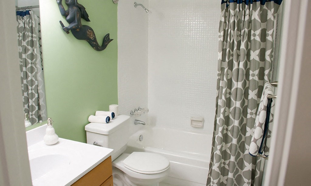 a bathroom with a sink toilet and bathtub
